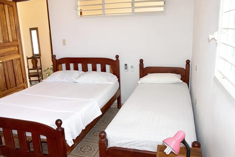 Comfort Triple Room | Minibar, in-room safe, individually decorated, individually furnished