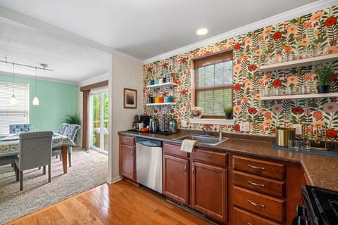 Morning Sun & Backyard Views – Sliding glass doors and windows bathe the dining area in light, creating a bright spot to gather, sip coffee, or plan your day in Pittsburgh.