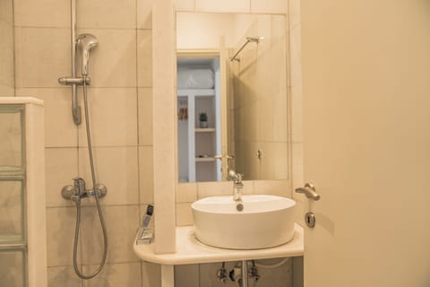 Standard Triple Room, Garden View | Bathroom | Shower, hair dryer, towels, soap