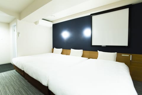 Standard Triple Room | Desk, laptop workspace, blackout drapes, free WiFi