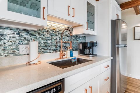 Kitchen is stocked with coffee for your enjoyment. Also included are dishes, utensils, dish detergent, paper towels, and other needed kitchen items to make your stay as comfortable as possible.