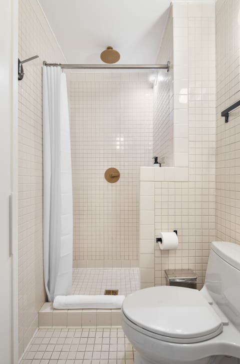 Family Room | Bathroom | Shower, rainfall showerhead, hair dryer, towels