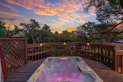 Take a dip in your private hot tub overlooking the majestic Red Rock mountains