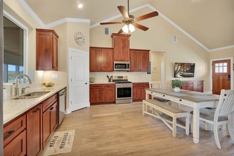 View of the kitchen looking toward the hallway leading to the garage, half bath, and Master bedroom (1).
