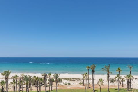 Private beach, white sand, sun loungers, beach umbrellas