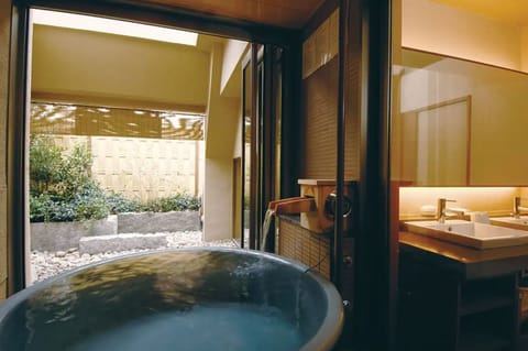 Japanese-Western Style Room with Open-air Bath, Half Board | Bathroom | Free toiletries, hair dryer, slippers, electronic bidet