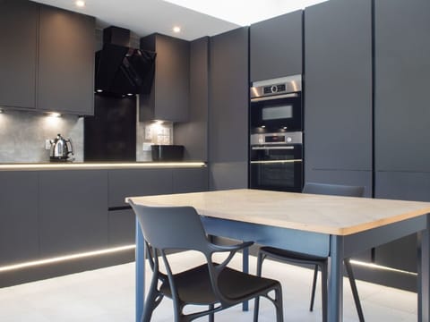 Table, Furniture, Property, Countertop, Cabinetry, Chair, Wood, Interior Design, Lighting, Shelf