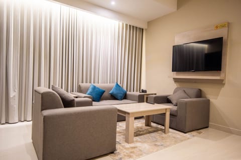 Deluxe Room, 1 Bedroom | Living area | 50-inch Smart TV with cable channels, printers