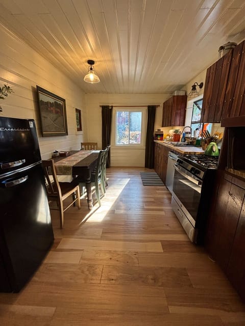Bright and spacious kitchen with modern appliances and a cozy dining area, perfect for preparing and enjoying meals together.