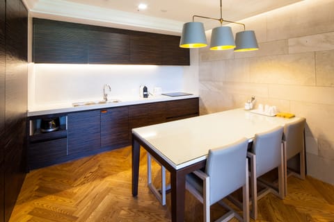 Fridge, electric kettle, dining tables