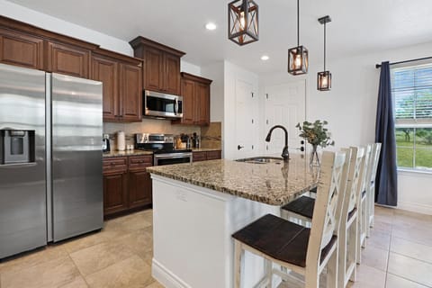 View showing the stainless steel appliances in the kitchen.
