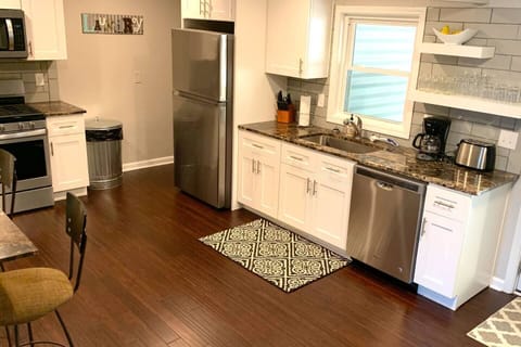 High end kitchen with stainless appliances and gas range