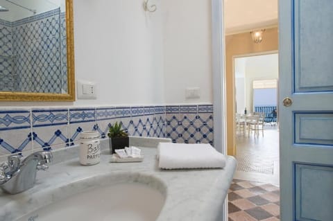 Suite, Sea View | Bathroom | Shower, hair dryer, slippers, towels