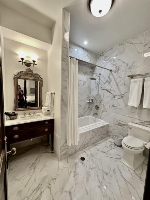 Aster Room | Bathroom | Jetted tub, rainfall showerhead, designer toiletries, hair dryer