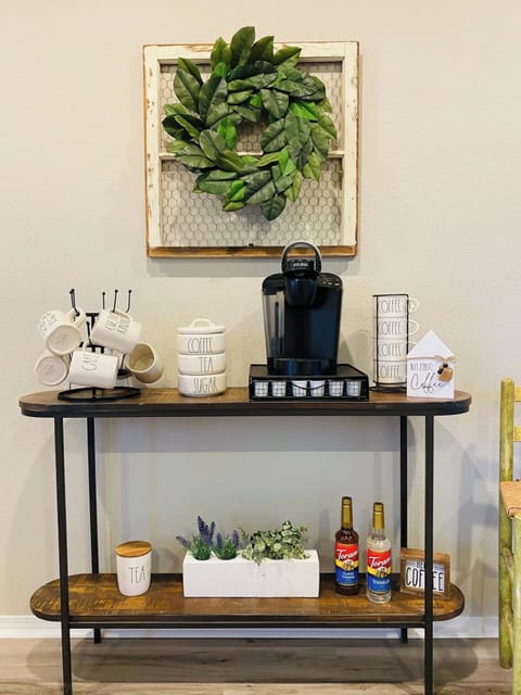 Coffee bar with a Keurig machine, several different coffees to choose from (light, medium, dark roast as well as flavors), caramel and vanilla liquid sweetener, sugar and cream! 