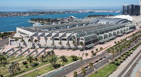 You would be staying 6-7 blocks away from the Convention Center or a 12-15 min walk depending on the traffic signals to cross Harbor Drive.