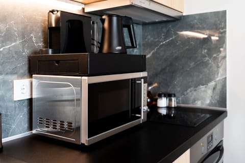 Deluxe Suite | Private kitchenette | Mini-fridge, espresso maker, electric kettle, cookware/dishes/utensils