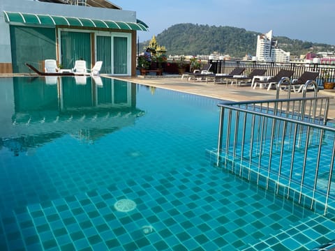 Outdoor pool, open 8:00 AM to 8:00 PM, sun loungers