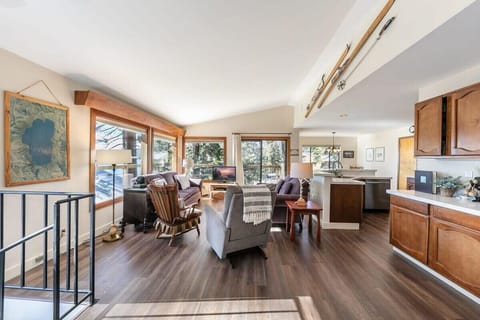 The upper floor features an open-layout living/kitchen/dining room providing an ideal space for relaxing with your group.