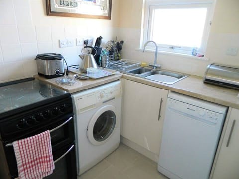Kitchen ( please note washing machine not usable but launderette just over the road ) 