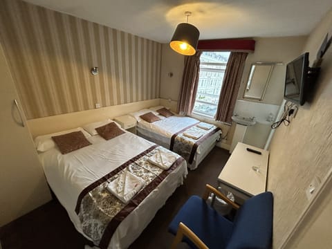 Standard Quadruple Room | Iron/ironing board, free WiFi, bed sheets