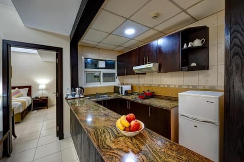 Family Apartment, 1 Bedroom | Private kitchen | Fridge, microwave, electric kettle, cookware/dishes/utensils