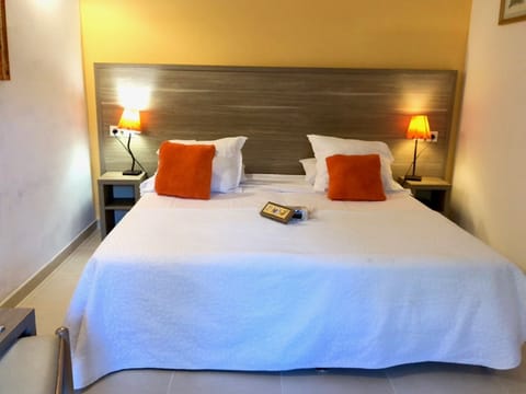 Superior Double Room | Minibar, in-room safe, individually decorated, desk