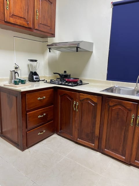 Standard Studio Suite | Private kitchen | Microwave, stovetop, coffee/tea maker, cleaning supplies