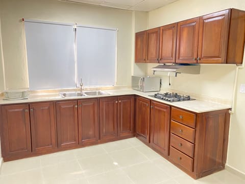 Grand Studio Suite | Private kitchen | Microwave, stovetop, coffee/tea maker, cleaning supplies