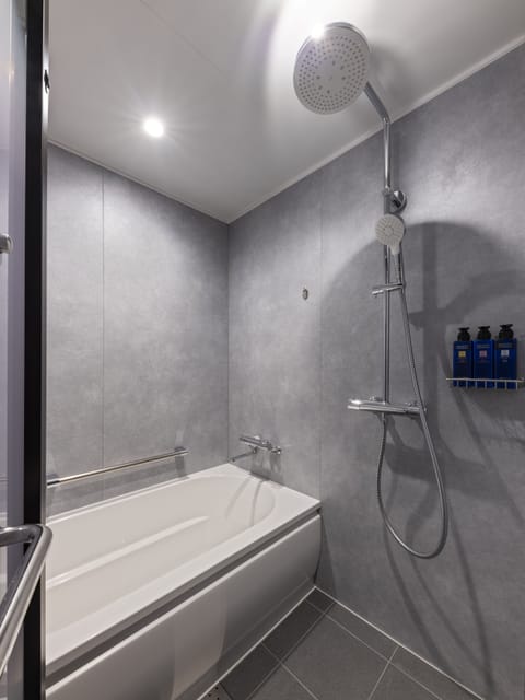Separate tub and shower, rainfall showerhead, hair dryer, slippers
