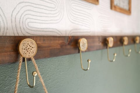 When you walk through our front door, you'll enter into a hallway with hooks for your belongings.