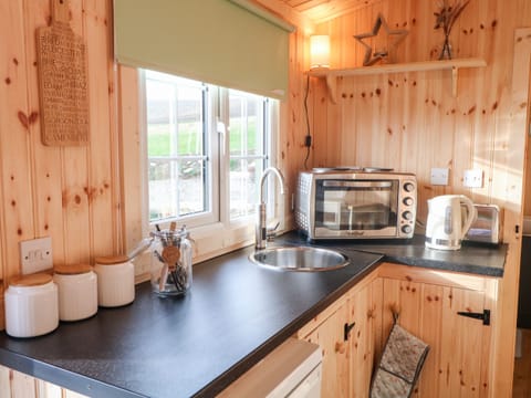 Fridge, electric kettle, toaster, cookware/dishes/utensils