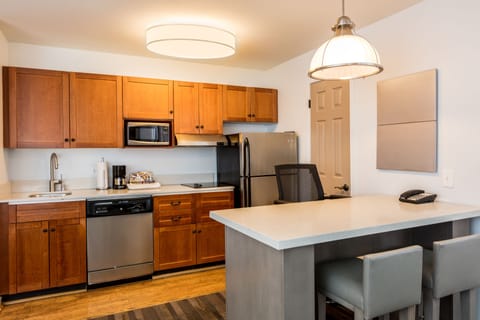 Suite, 1 Bedroom | Private kitchen | Fridge, microwave, stovetop, dishwasher