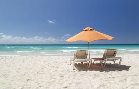 Beach nearby, white sand, sun loungers, beach towels