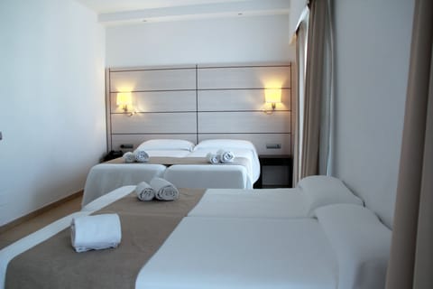 Quadruple Room, Balcony | Bathroom | Shower, free toiletries, hair dryer, towels