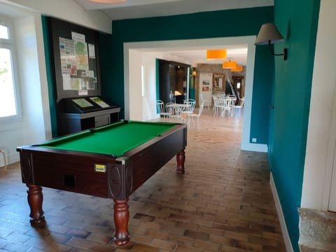 Play a game of billiards with friends and family.