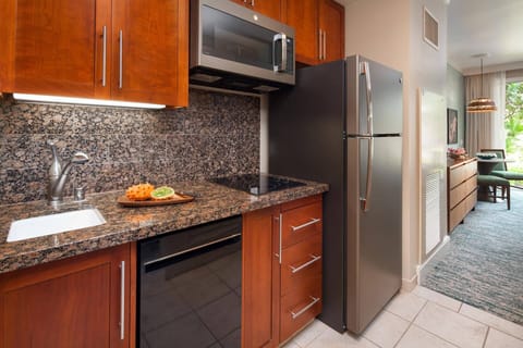 Guest bedroom comes with a well-equipped kitchenette.