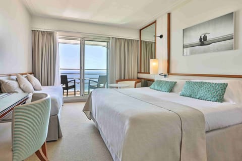 Triple Room, Sea View | Premium bedding, minibar, in-room safe, desk