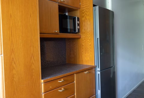 Comfort Apartment | Private kitchen | Full-size fridge, microwave, oven, stovetop