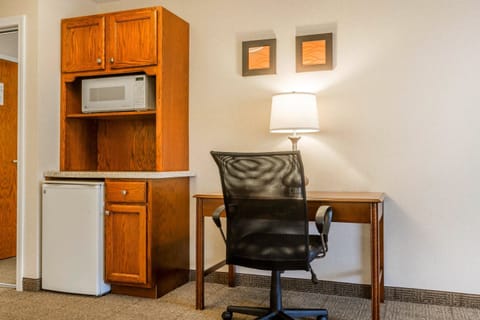 Desk, laptop workspace, blackout drapes, iron/ironing board