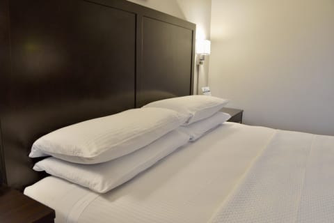 Premium bedding, pillowtop beds, desk, laptop workspace