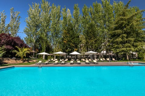 Seasonal outdoor pool, open 10:30 AM to 9:00 PM, pool umbrellas