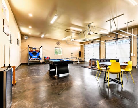 The Shop is the perfect hangout spot which features a pool table, ping pong table, foosball table, basketball arcade, a 65 inch TV, and a beverage fridge.