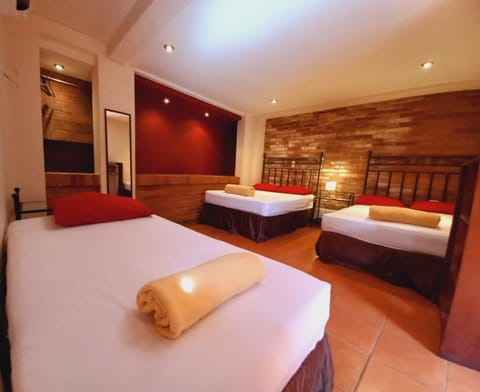 Deluxe Room, Multiple Beds, Private Bathroom, Tower | Premium bedding, down comforters, free WiFi