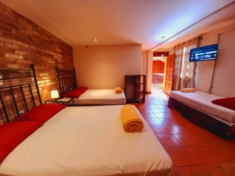 Deluxe Room, Multiple Beds, Private Bathroom, Tower | Premium bedding, down comforters, free WiFi