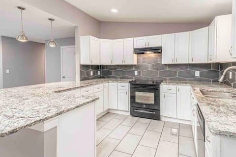 Whip up quick bites in this organized kitchen, perfect for group eats.