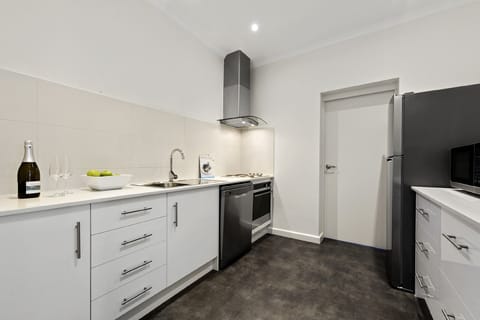 Executive Two Bedroom Apartment | Private kitchen | Fridge, microwave, stovetop, electric kettle