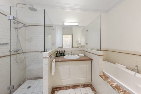 Grand Room, 1 King Bed (Valley View) | Bathroom | Shower, rainfall showerhead, designer toiletries, hair dryer