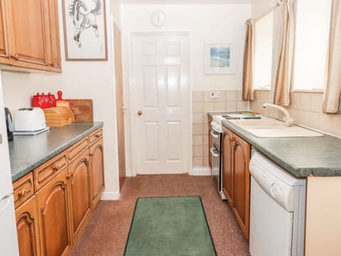 Fridge, electric kettle, cookware/dishes/utensils