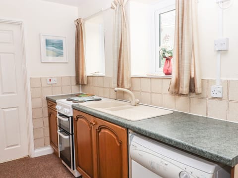 Fridge, electric kettle, cookware/dishes/utensils